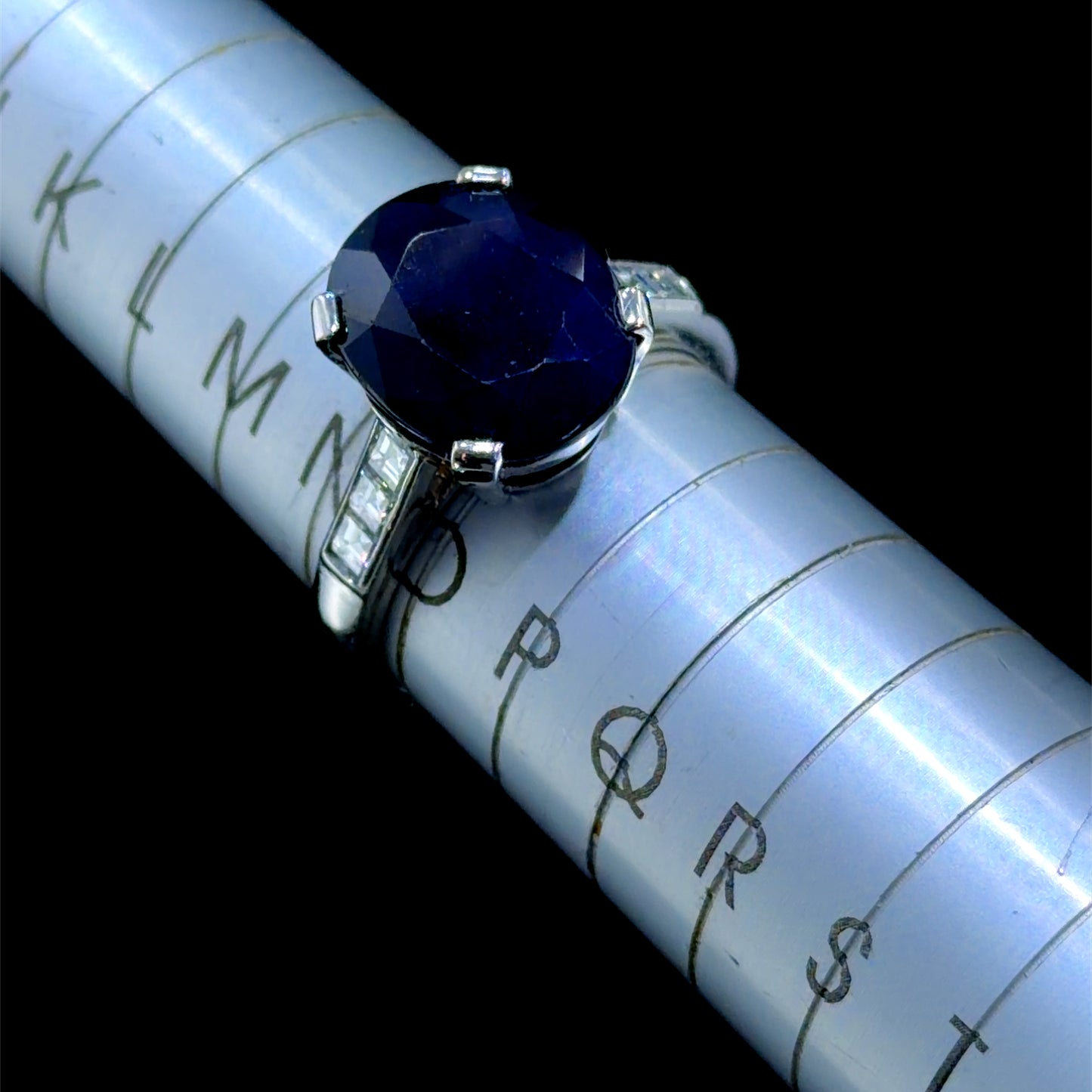 A Beautiful Platinum Ring Having A Wonderful Mid Blue Sapphire of Appx 5 Cts Flanked By Asscher Cut Diamonds of Appx 0.6 Cts to The Shoulders