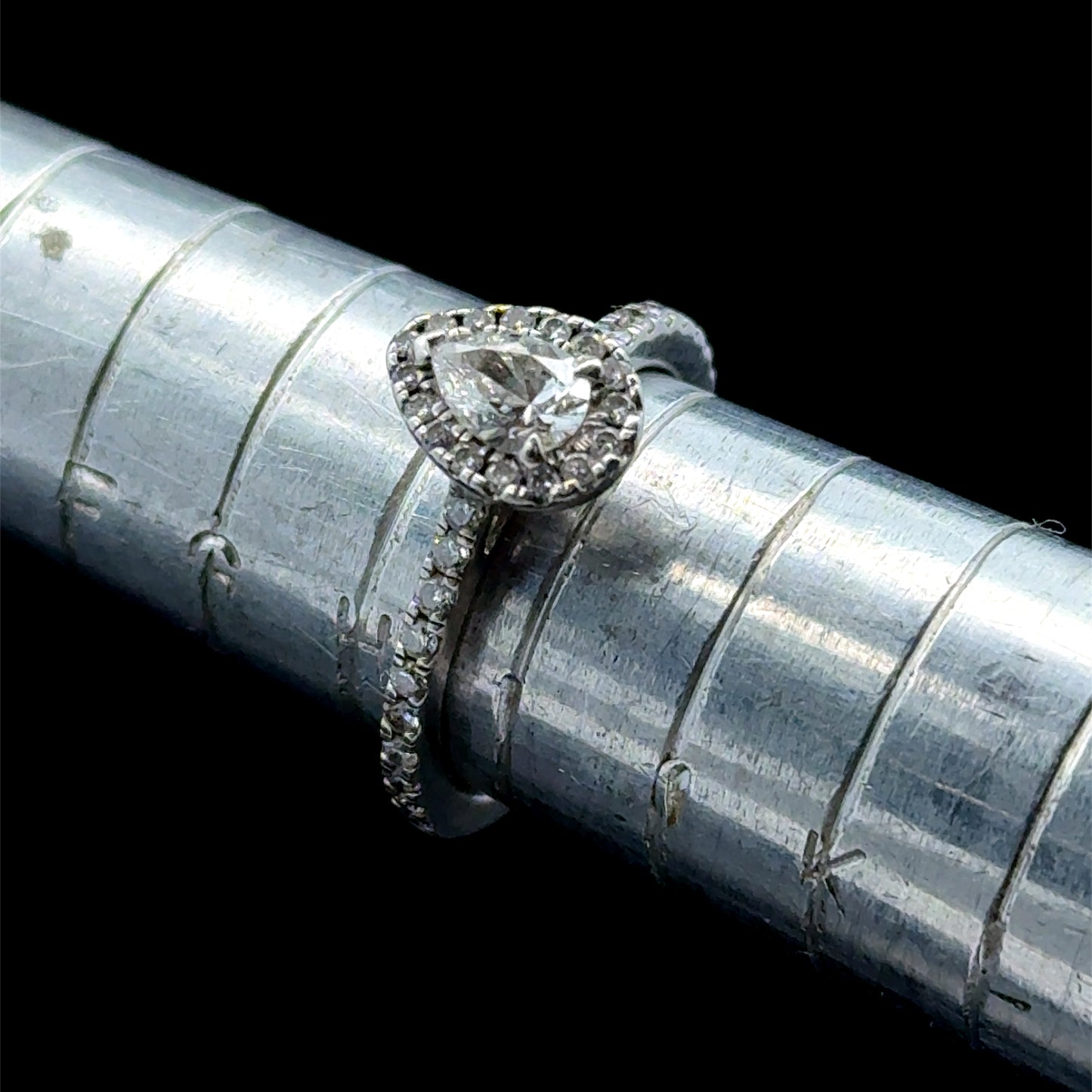 Platinum Pear Diamond Halo Ring with Diamonds to Shoulders