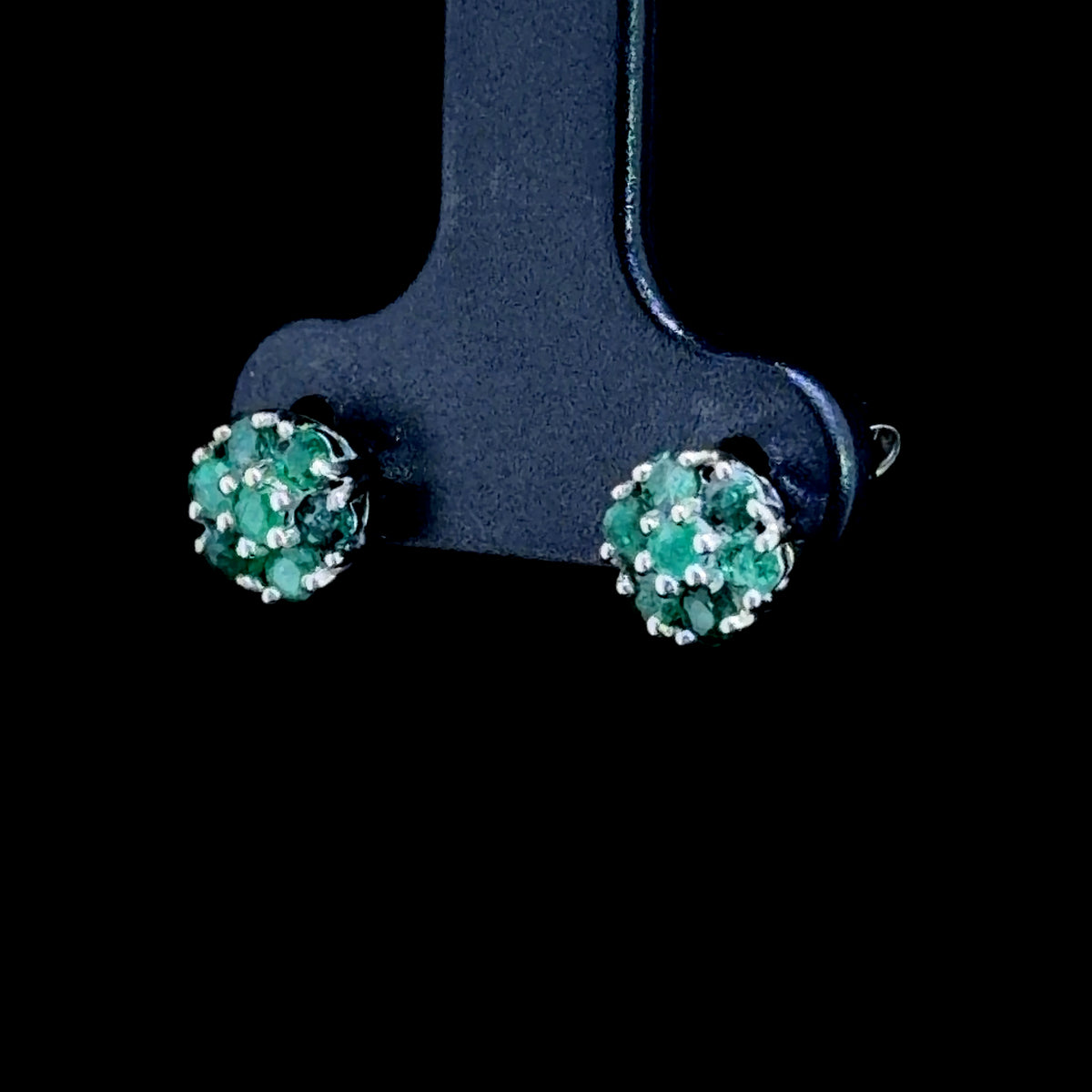 A Sweet Pair Of 9k White Gold Emerald Daisy Stud Earrings