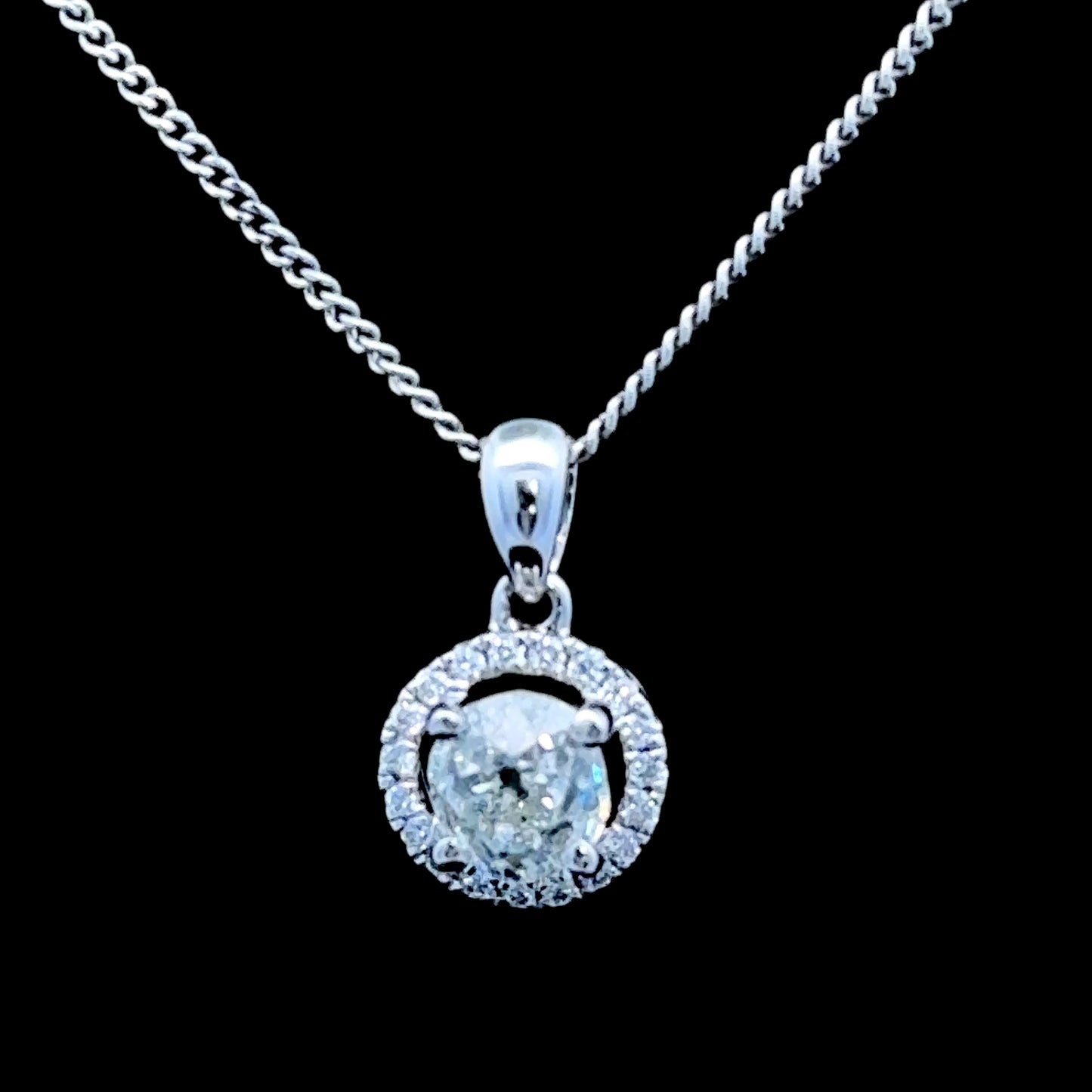 18K White Gold Diamond Halo Pendant C: 0.6 CTS Total: 0.75 CTS