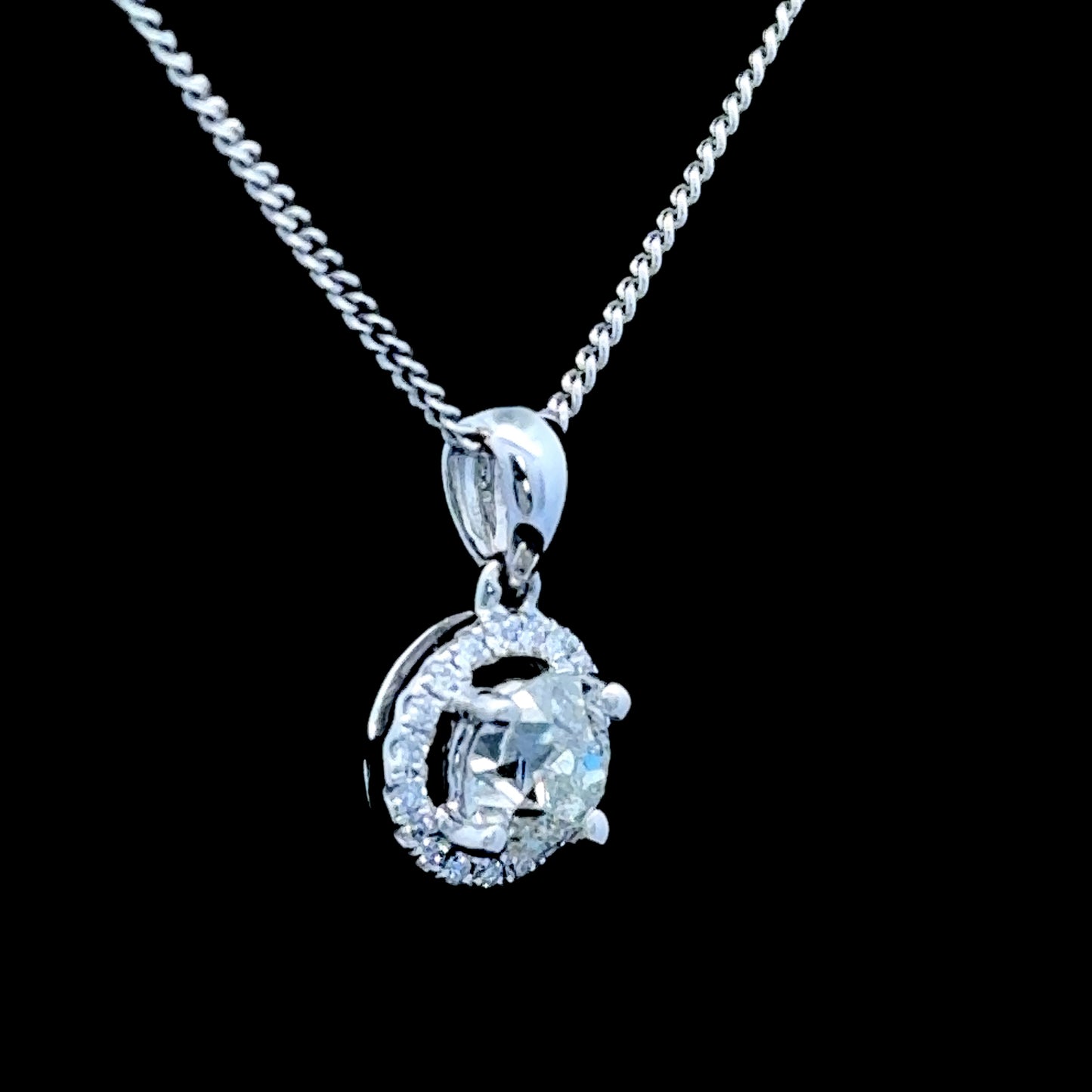18K White Gold Diamond Halo Pendant C: 0.6 CTS Total: 0.75 CTS