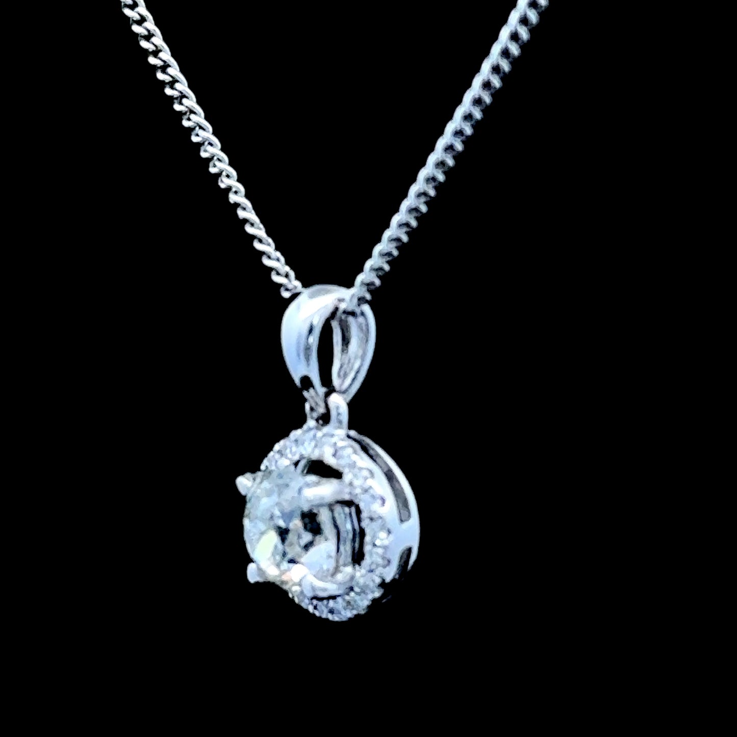 18K White Gold Diamond Halo Pendant C: 0.6 CTS Total: 0.75 CTS