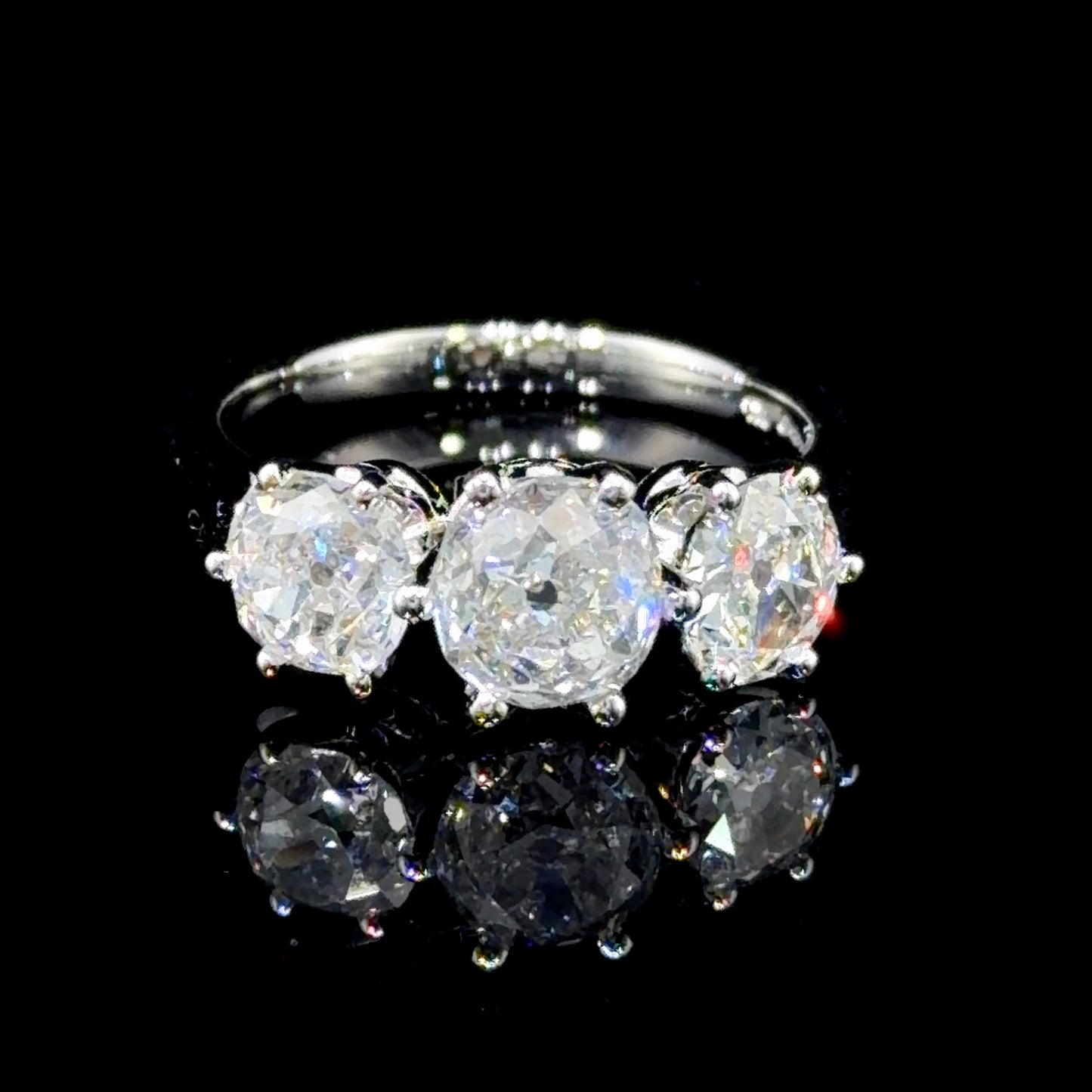 A Spectacular Platinum & Old Cut Diamond Trilogy Ring of 2.7 Cts