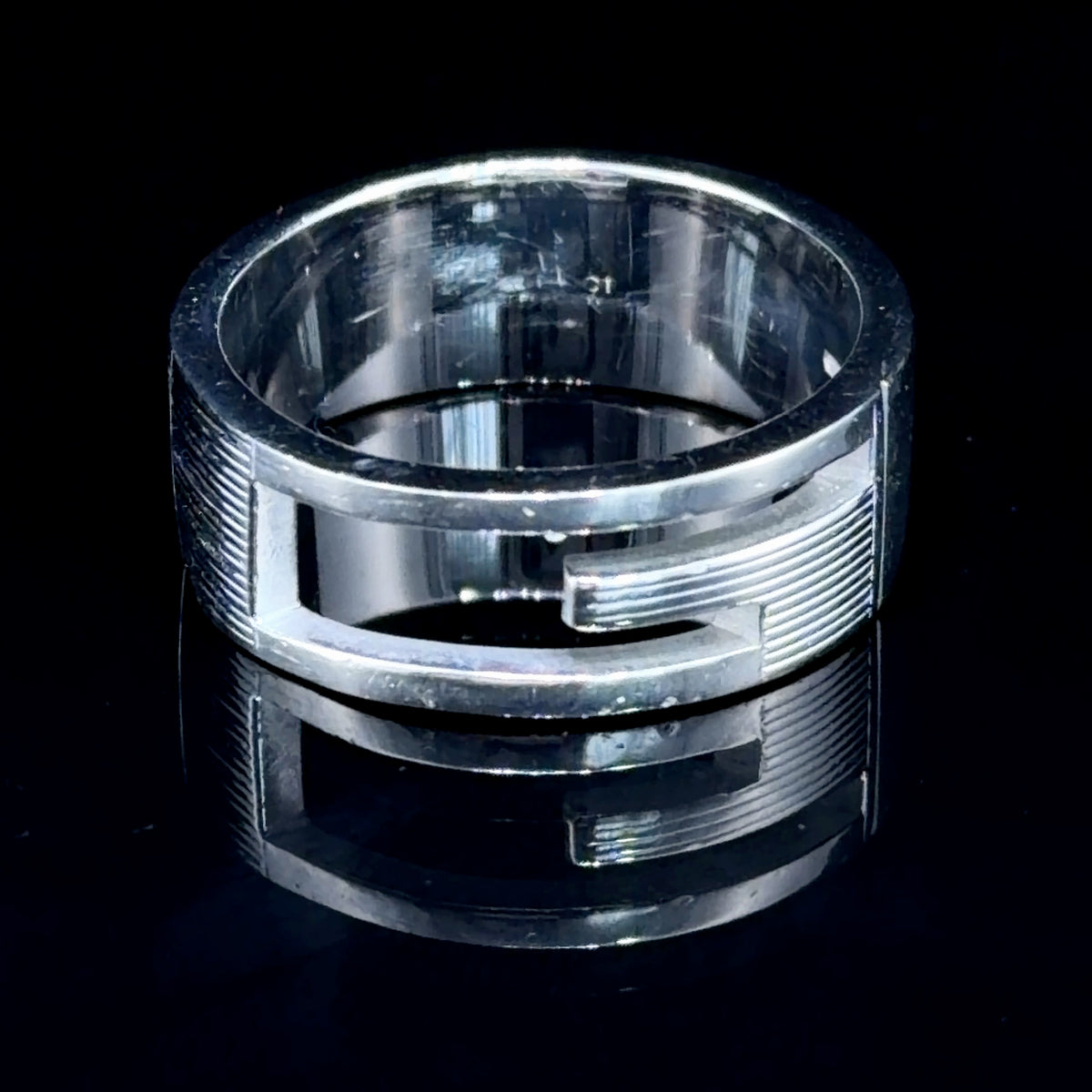 A Sterling Silver G Ring Featuring A Ribbed Finish By Gucci