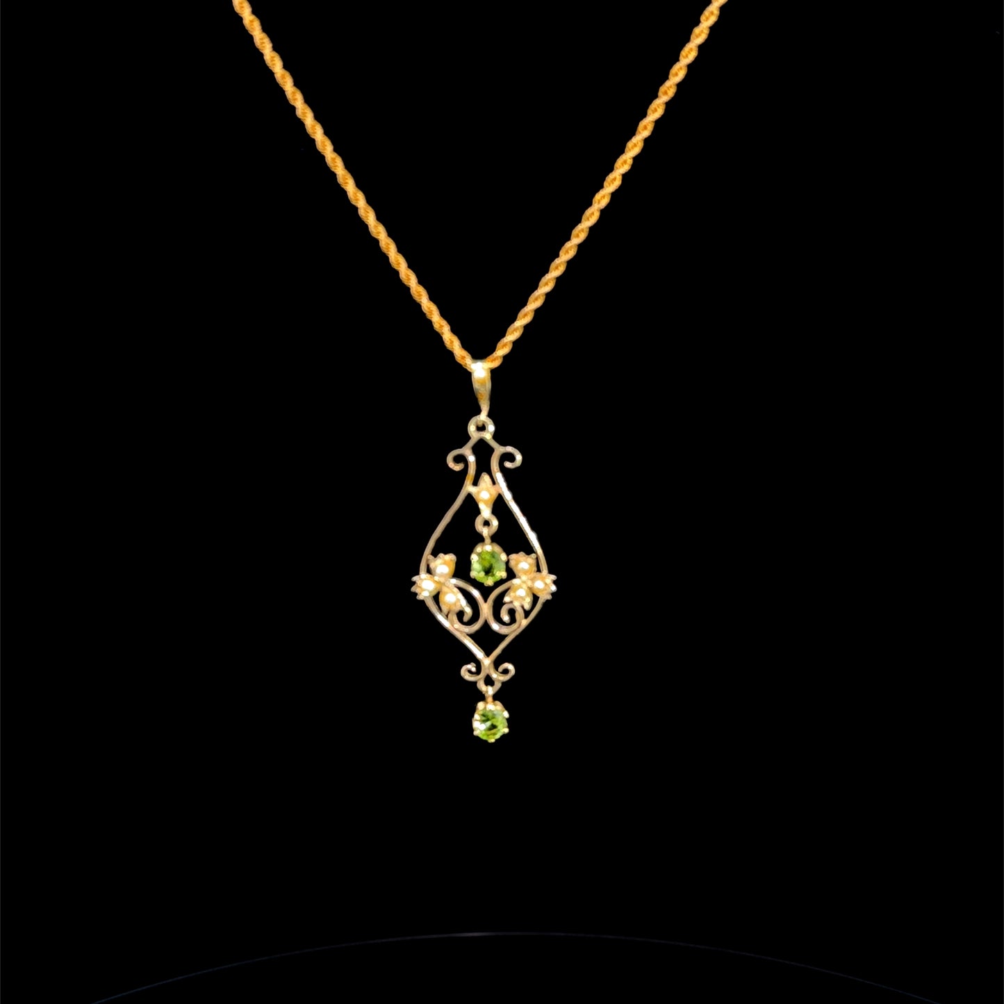 An Antique Peridot & Pearl Drop Pendant & Rope Twist Chain