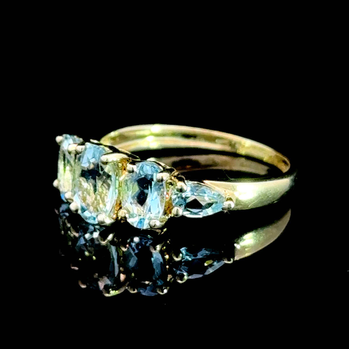 9K Yellow Gold 5 Stone Light Blue Topaz Ring