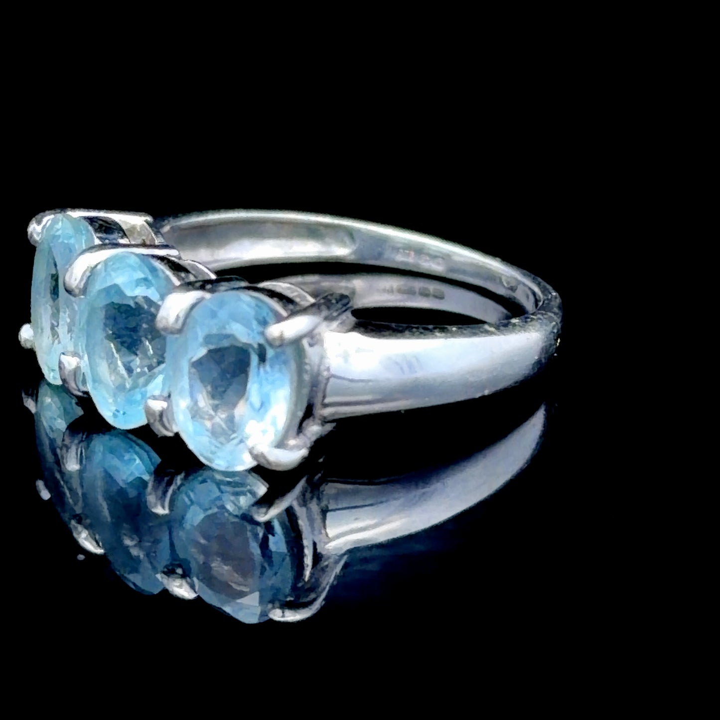 9k White Gold Oval Blue Topaz Trilogy Ring