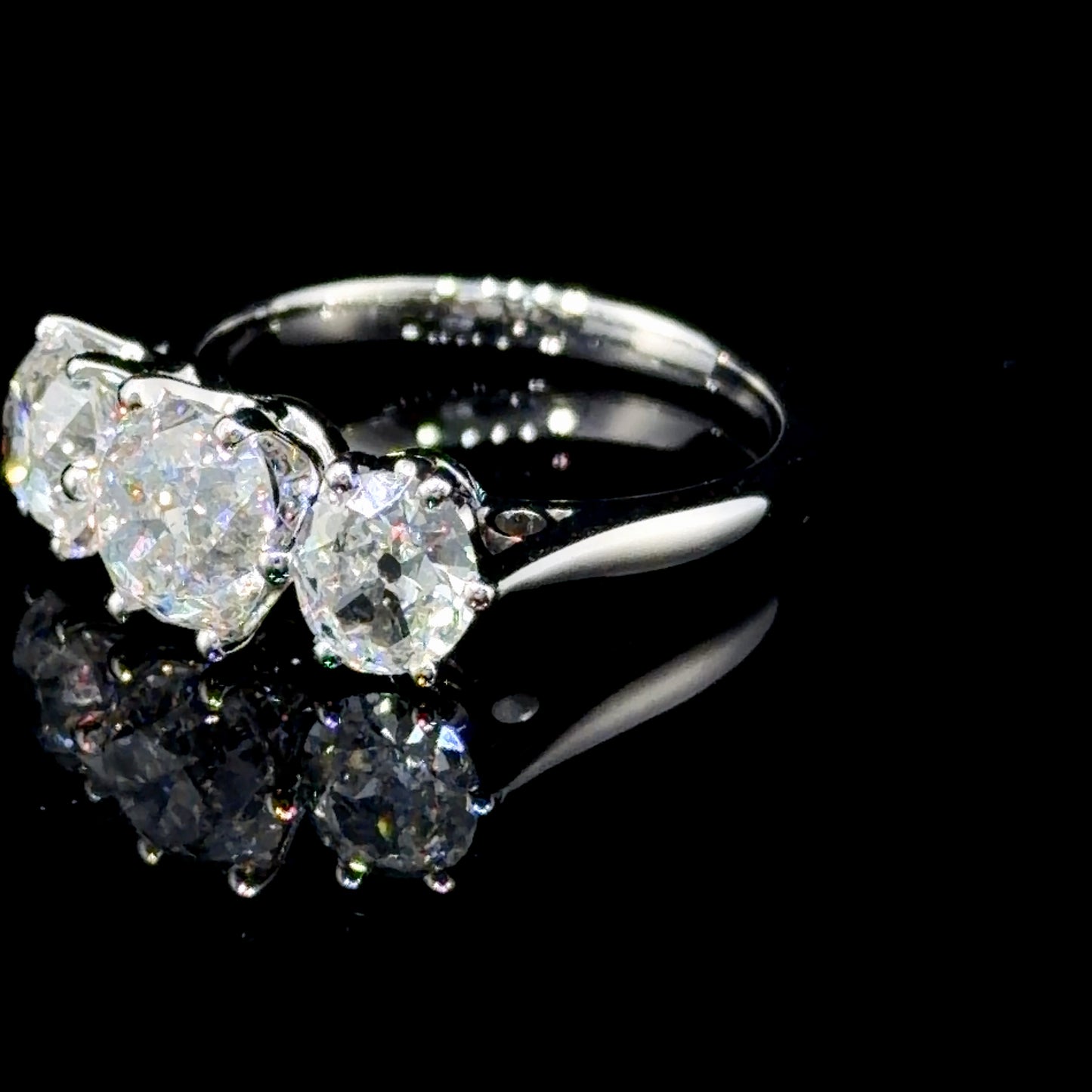 A Spectacular Platinum & Old Cut Diamond Trilogy Ring of 2.7 Cts