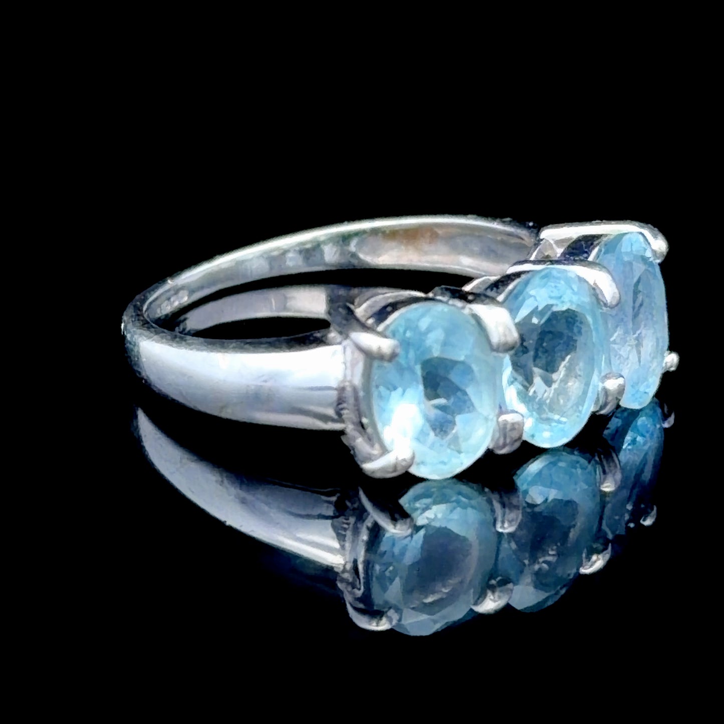9k White Gold Oval Blue Topaz Trilogy Ring