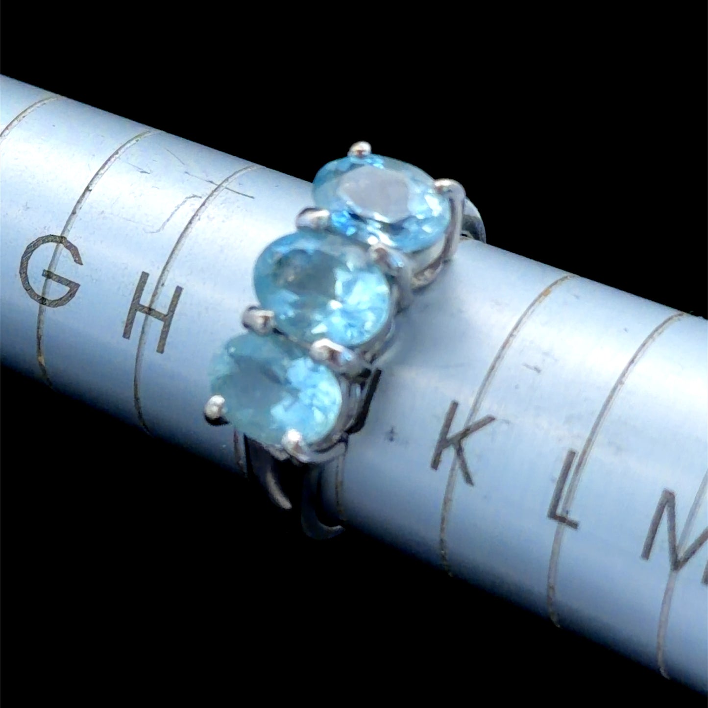 9k White Gold Oval Blue Topaz Trilogy Ring