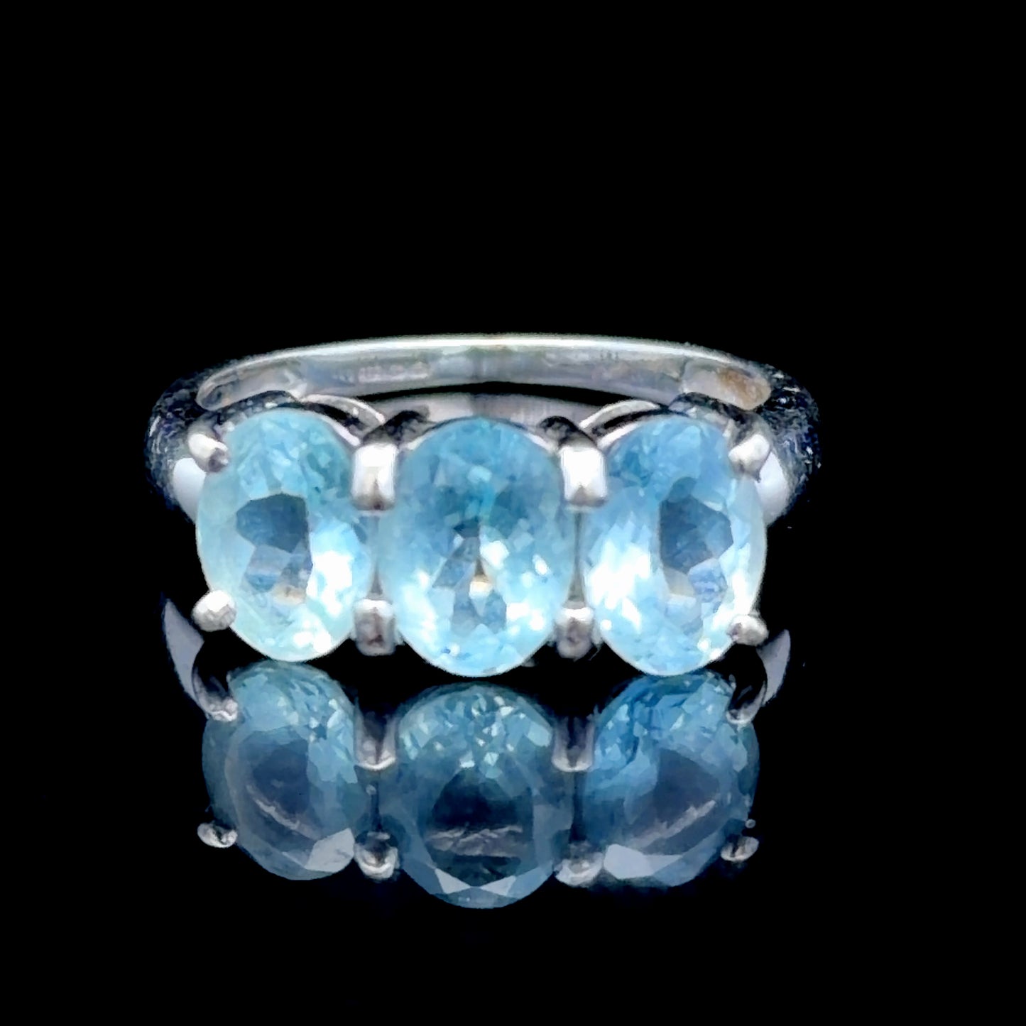 9k White Gold Oval Blue Topaz Trilogy Ring