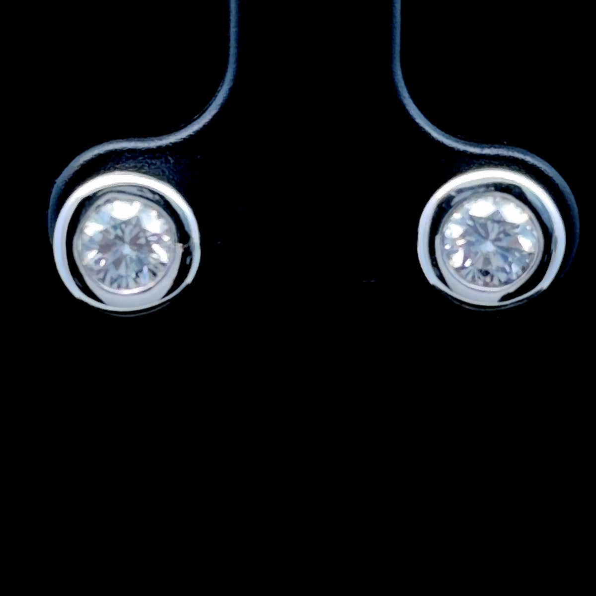 A Very Nice Pair Of 18k White Gold Bezel Set Diamond Stud Earrings 0.6 Cts Total