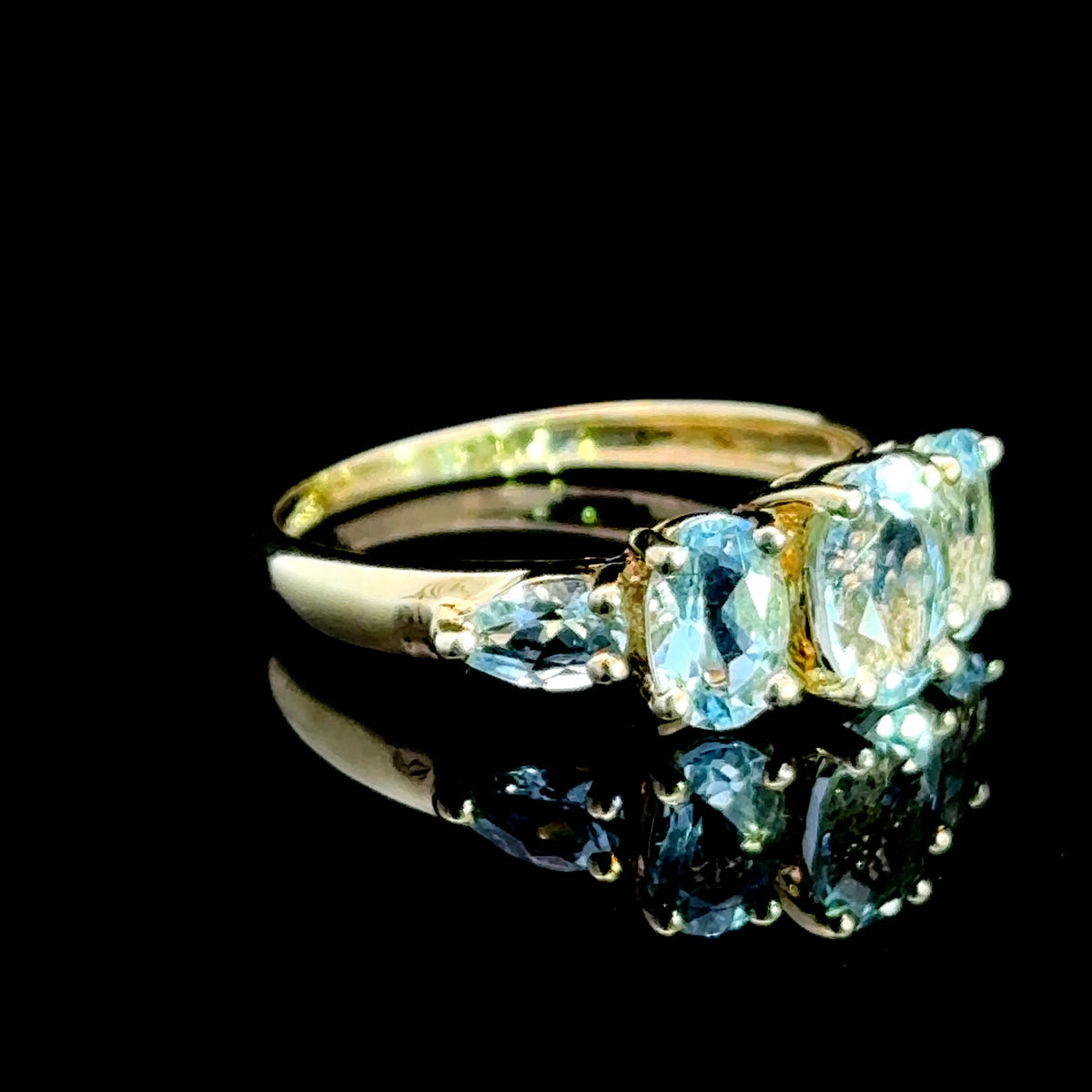 9K Yellow Gold 5 Stone Light Blue Topaz Ring