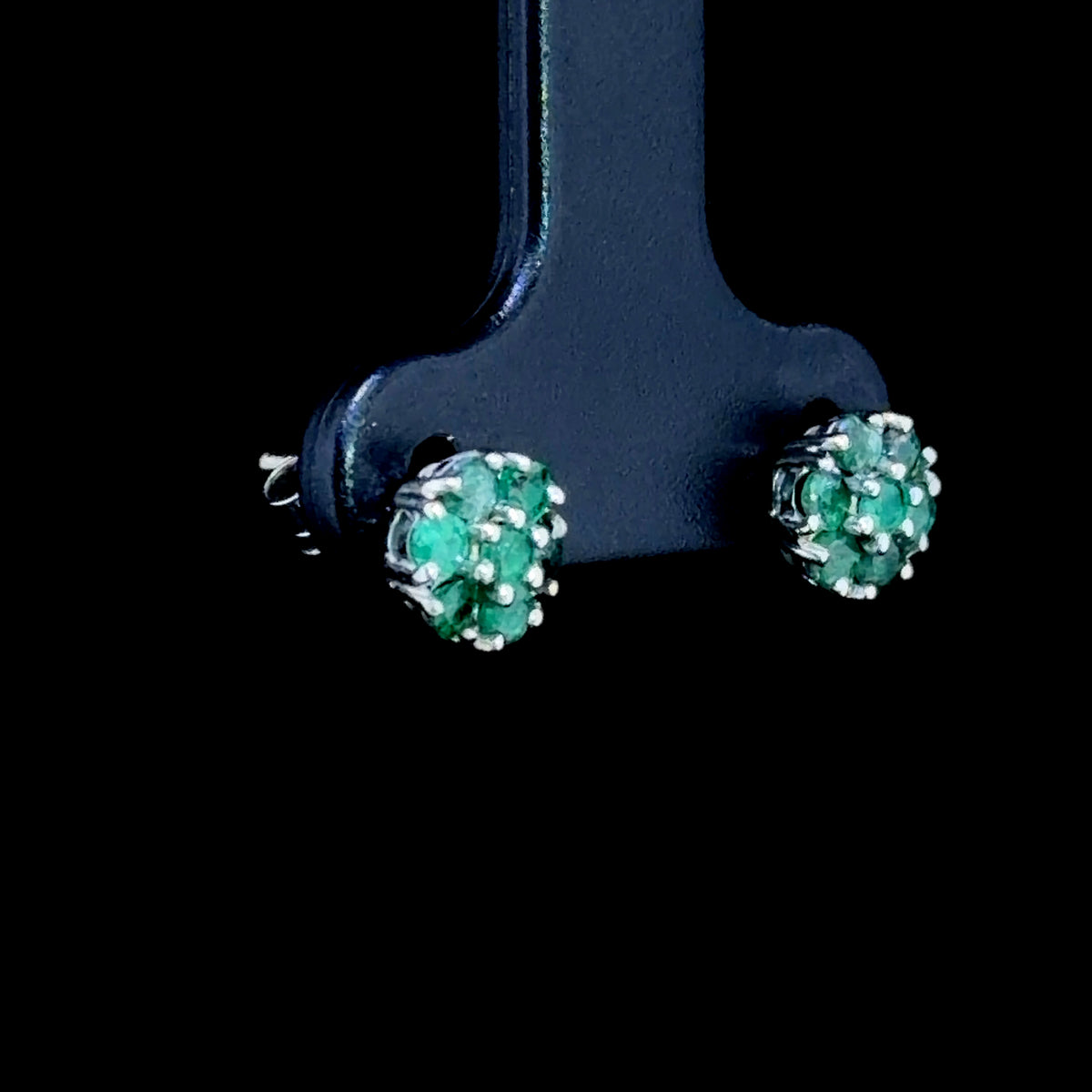 A Sweet Pair Of 9k White Gold Emerald Daisy Stud Earrings