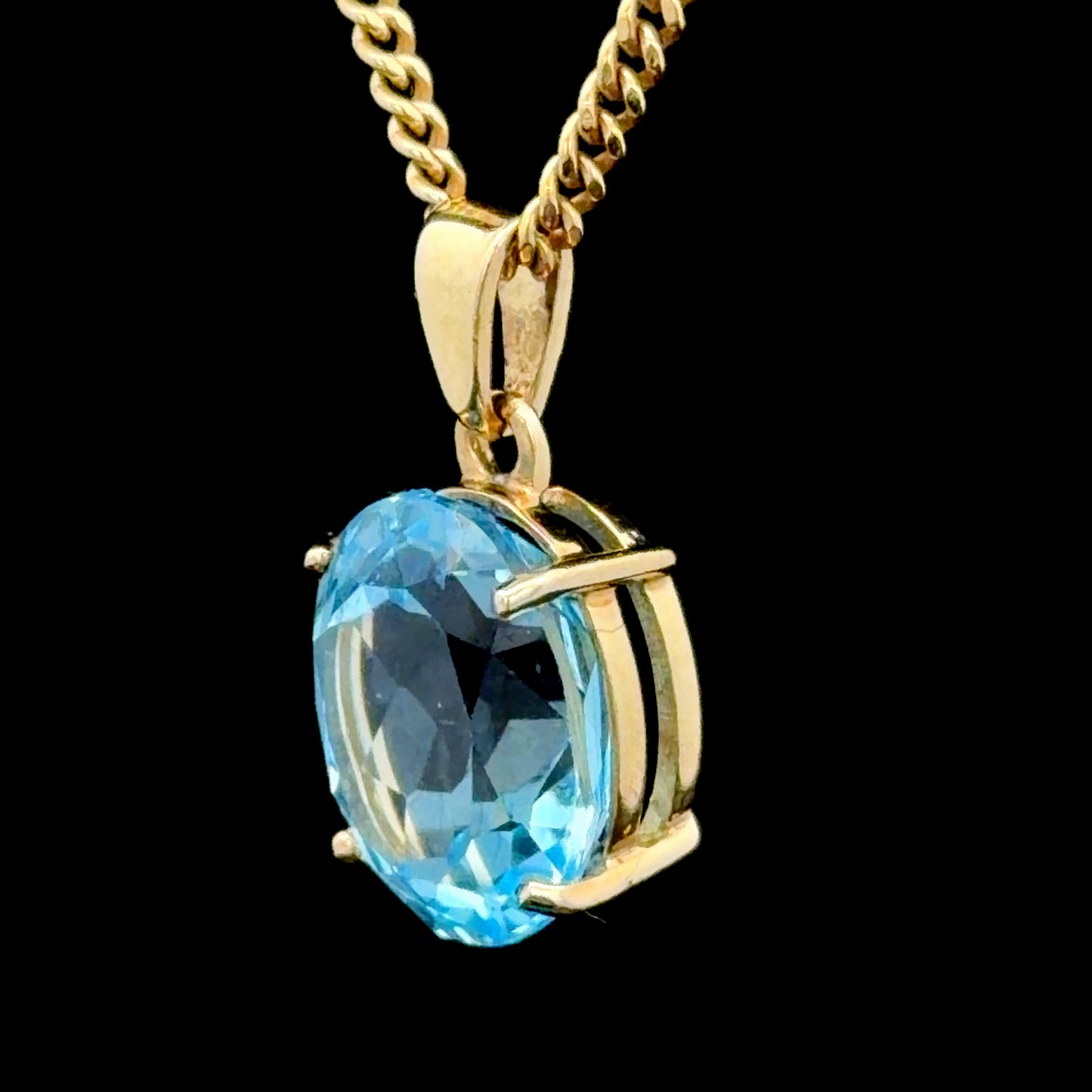 9k Yellow Gold Oval Blue Topaz Pendant