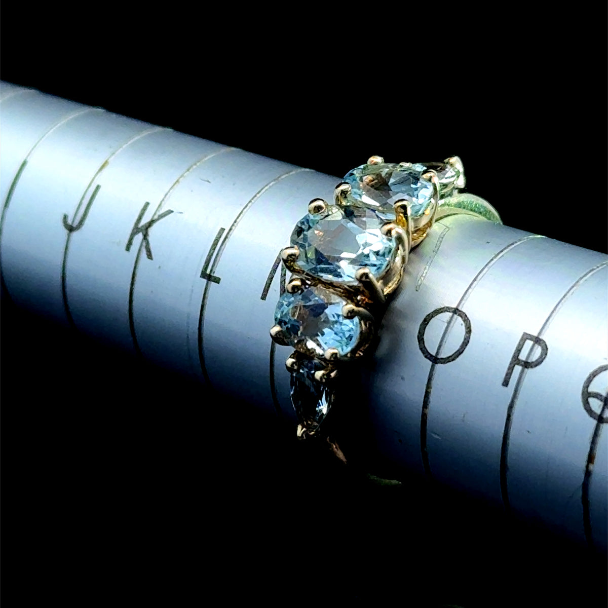 9K Yellow Gold 5 Stone Light Blue Topaz Ring